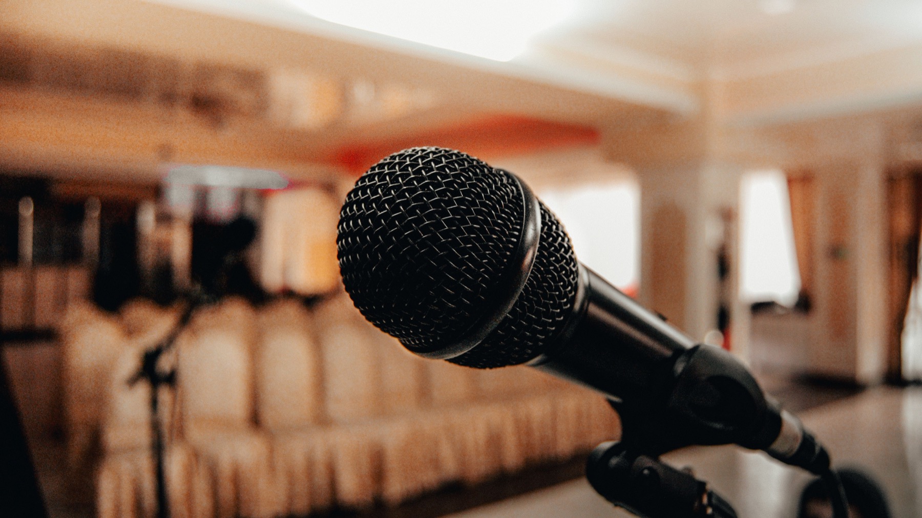 A microphone in an empty conference hall