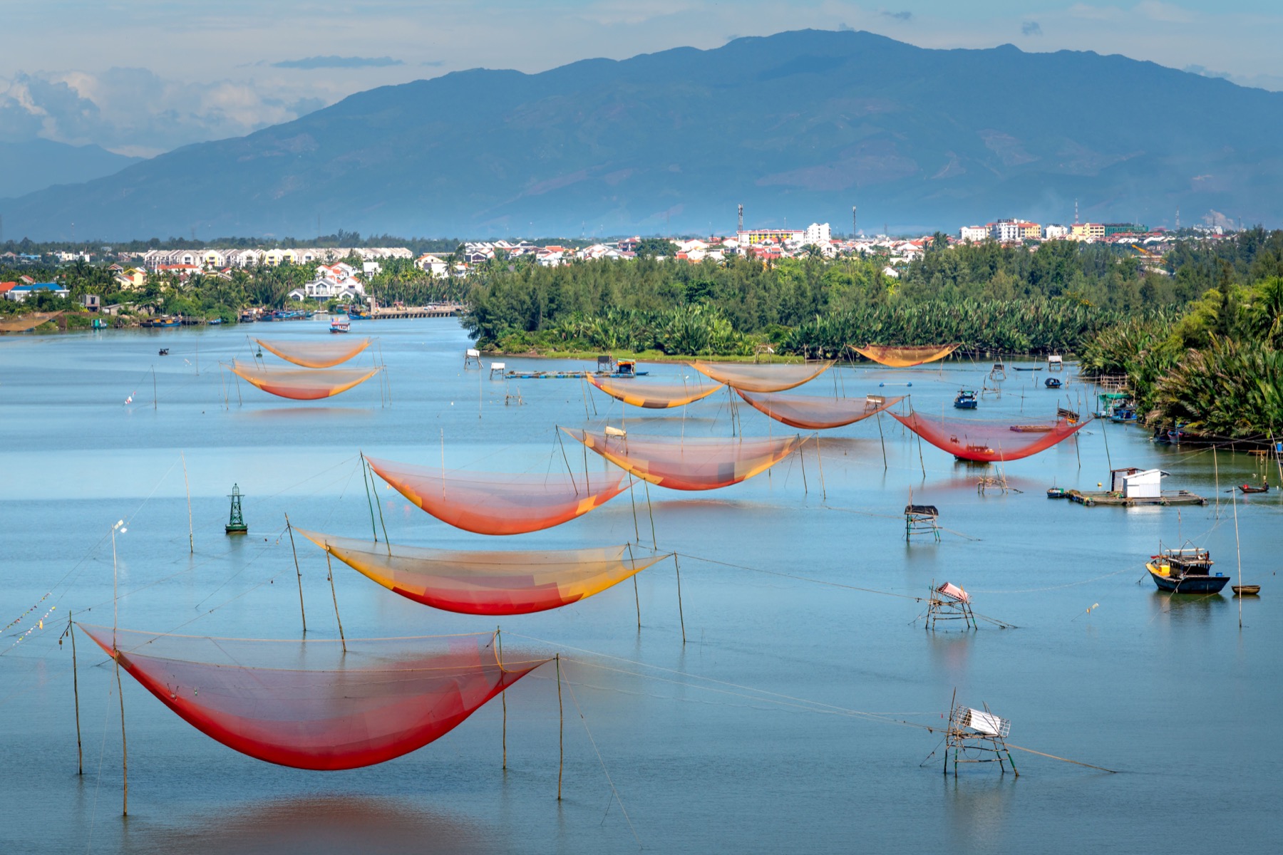 Large fishing nets stretch across a lake, illustrating a broad search