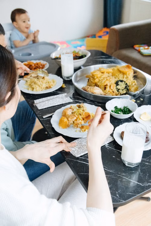 A family sharing a homemade meal around a dining table
