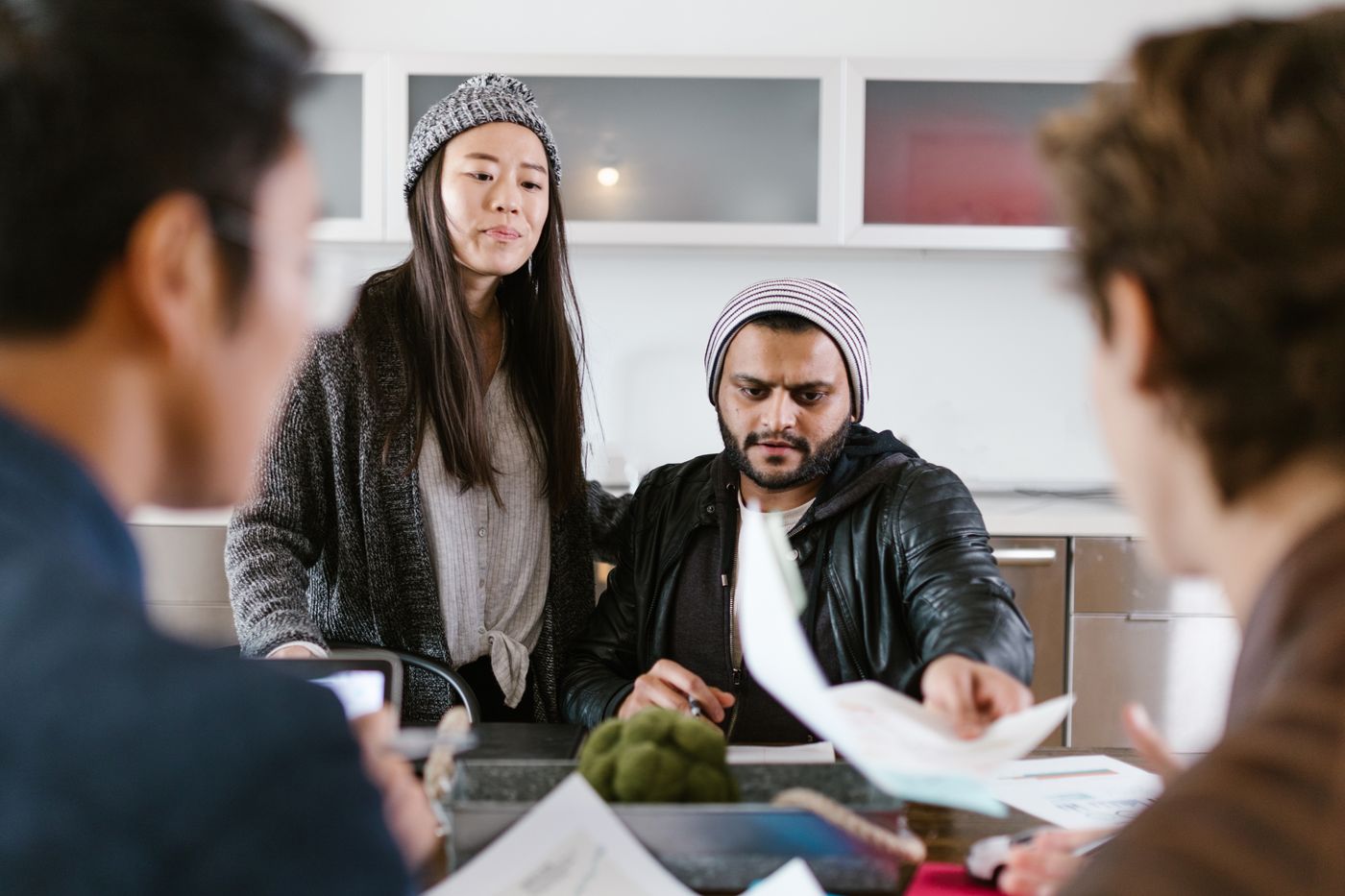 A startup team collaborating on an energetic project