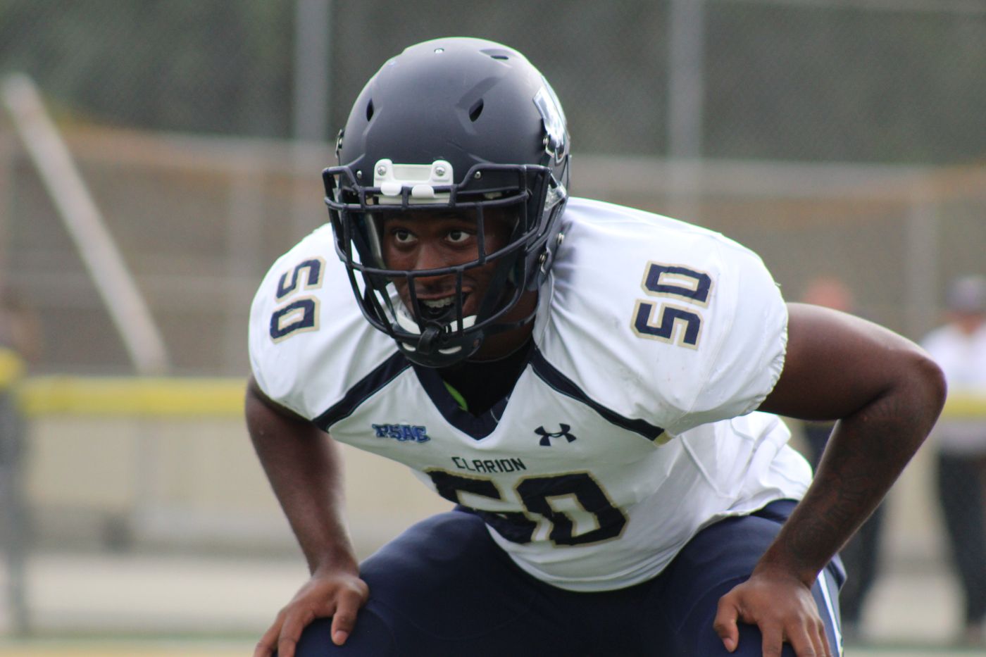 American football player preparing to start a play