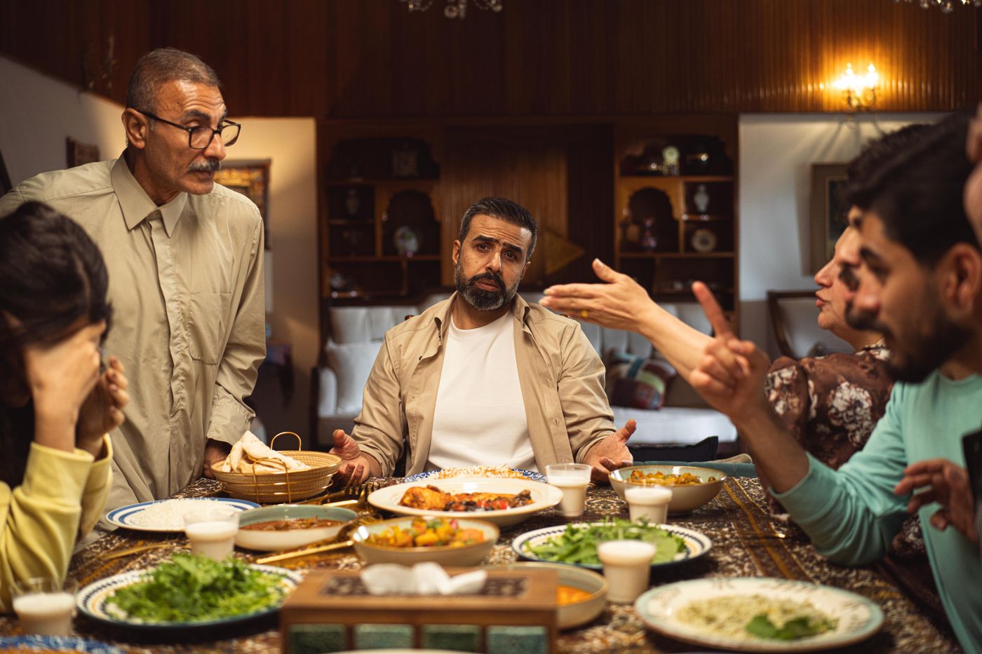 Family members talking together around a dinner table