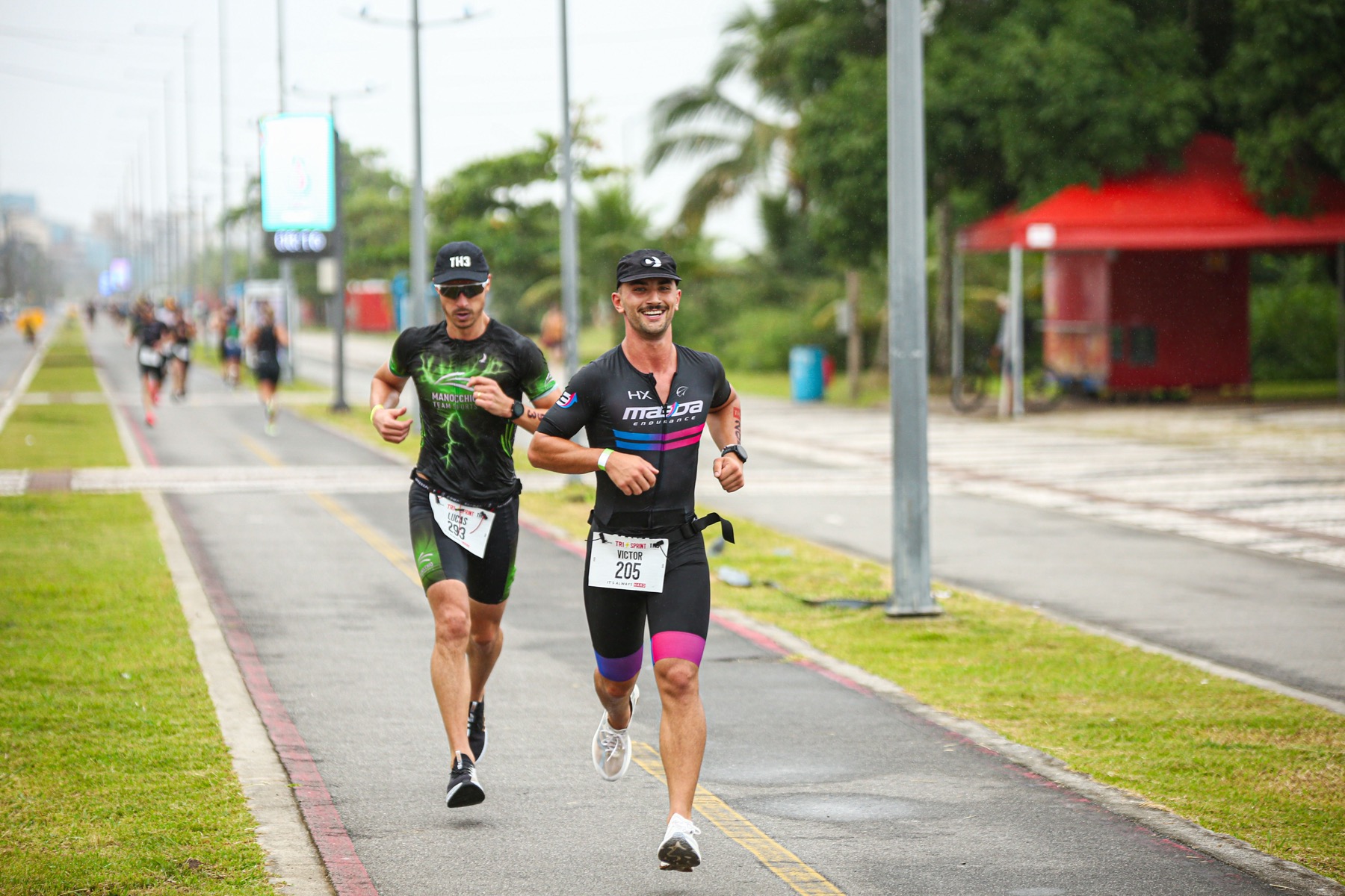 Two runners competing in a city marathon