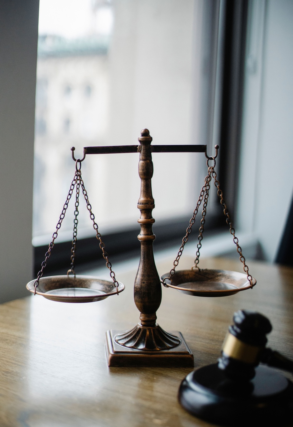 A gavel and scales of justice on a desk