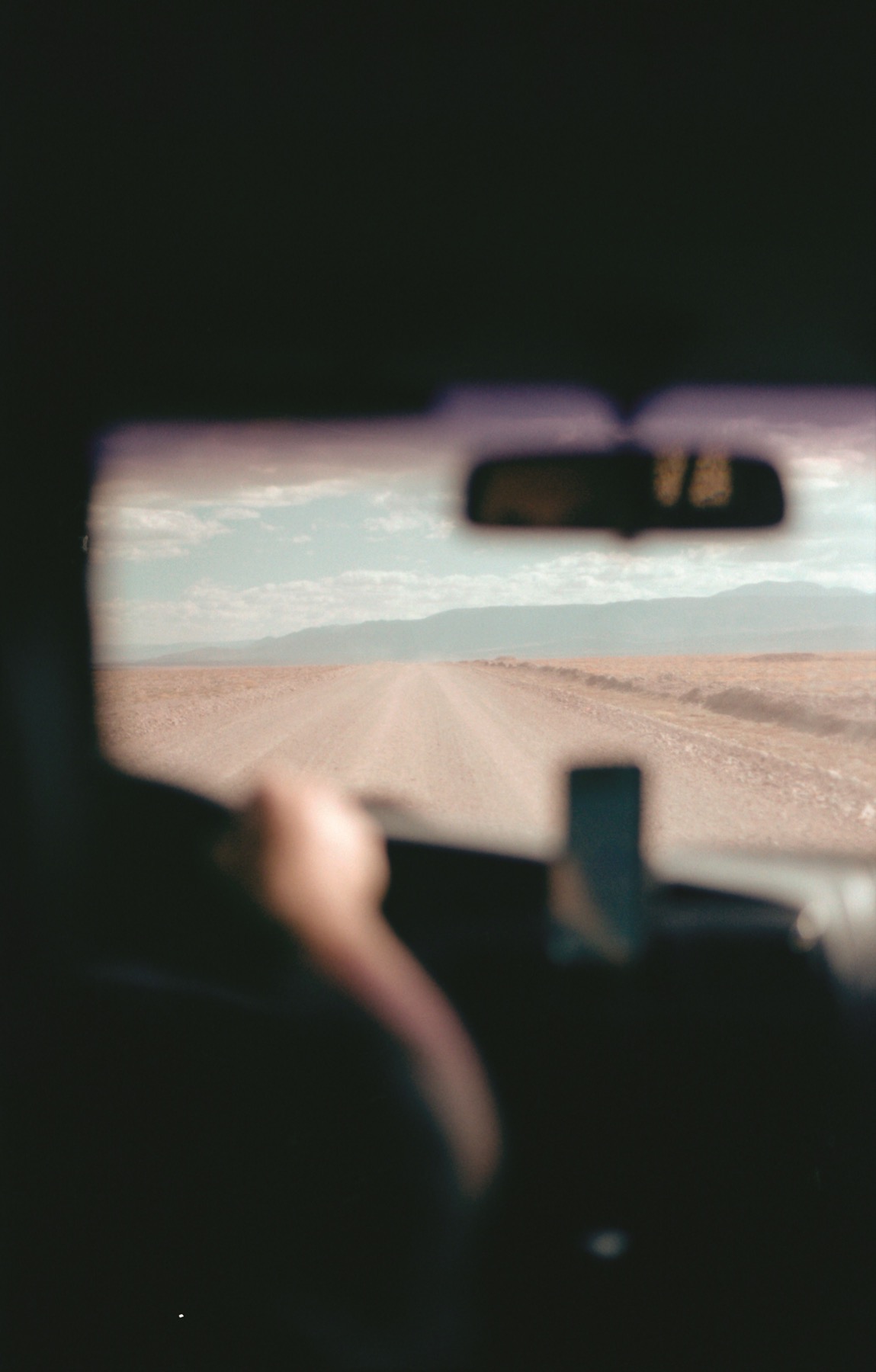 View through a car windshield along an open road